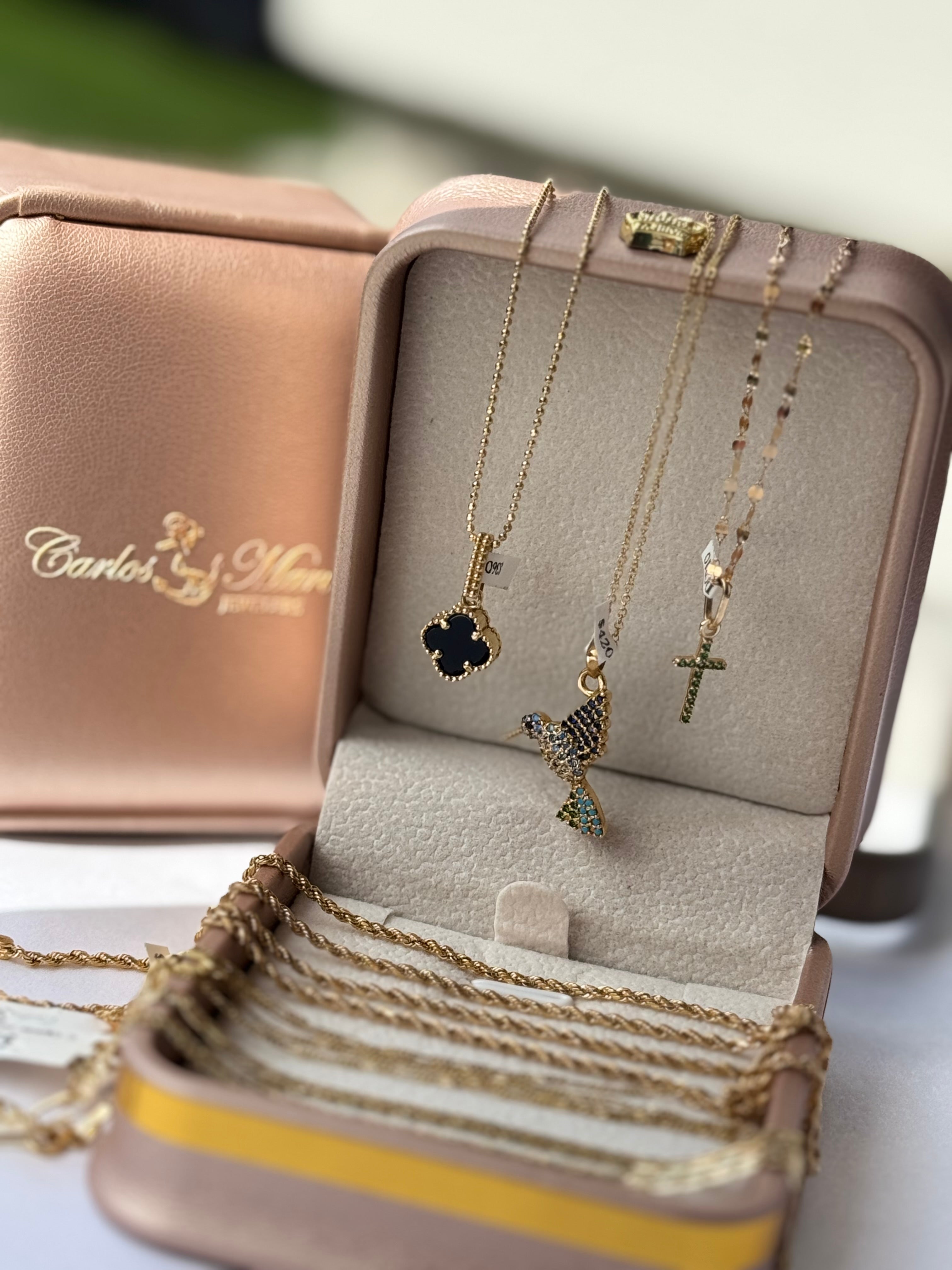 Dije cruz circonias verdes oro 18k